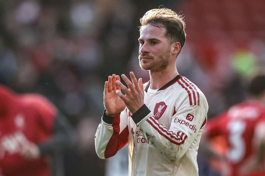 Mac Allister applauds the travelling supporters