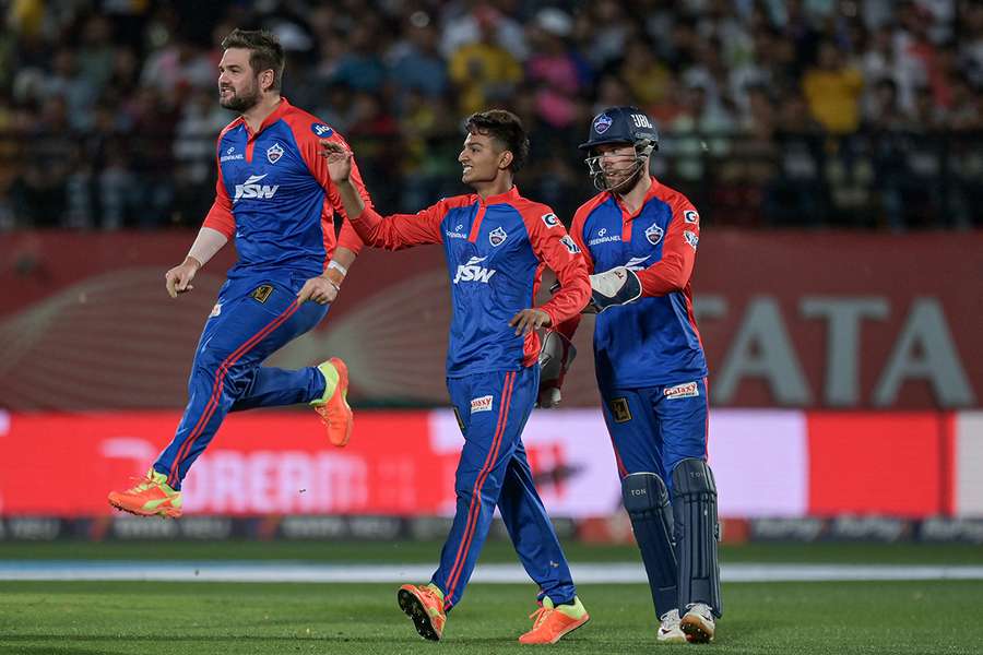 Delhi Capitals' Rilee Rossouw (L) celebrates with teammates