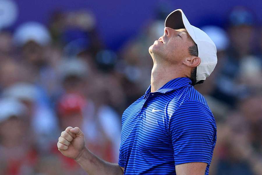 Rory McIlroy celebrates holing the birdie putt on the 18th hole to secure his two shot win during the final round of the DP World Tour Championship