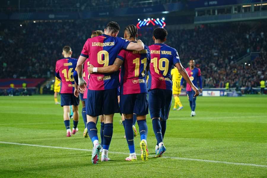 Robert Lewandowski celebrates scoring for Barcelona against Dortmund with Raphinha and Lamine Yamal. Robert Lewandowski celebrates scoring for Barcelona against Dortmund with Raphinha and Lamine Yamal.