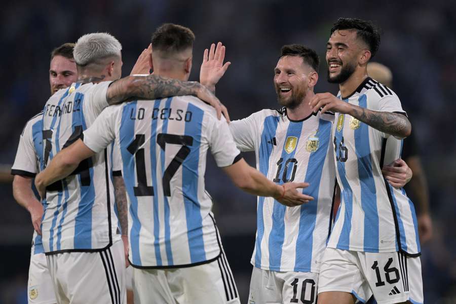Argentina's midfielder Enzo Fernandez (L) celebrates with (L to R) midfielder Giovani Lo Celso, forward Lionel Messi and forward Nicolas Gonzalez