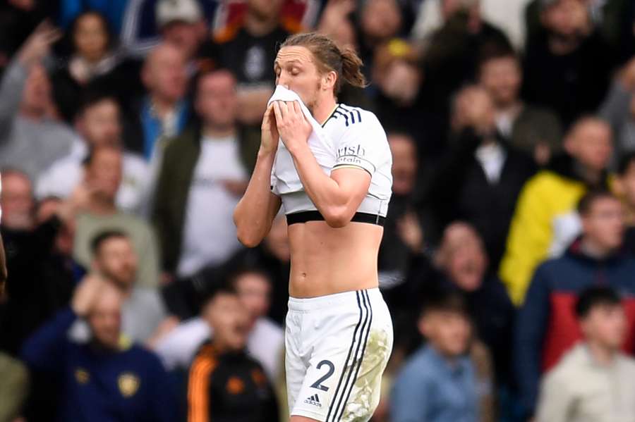 Leeds United's English defender Luke Ayling reacts after Leeds concede their fourth goal