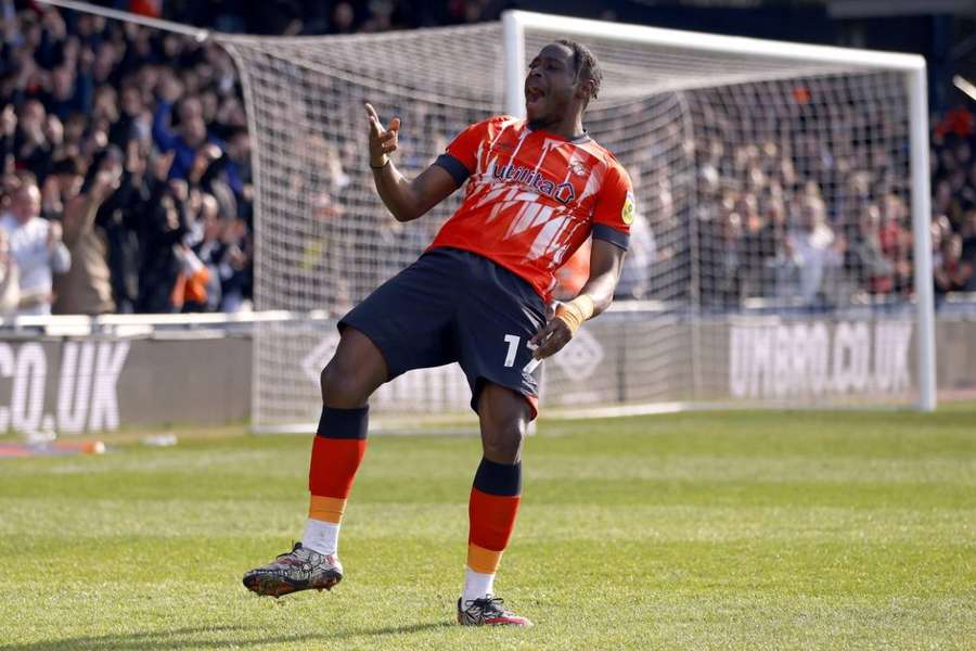 Pelly Ruddock Mpanzu celebrates his goal against Blackpool earlier this season