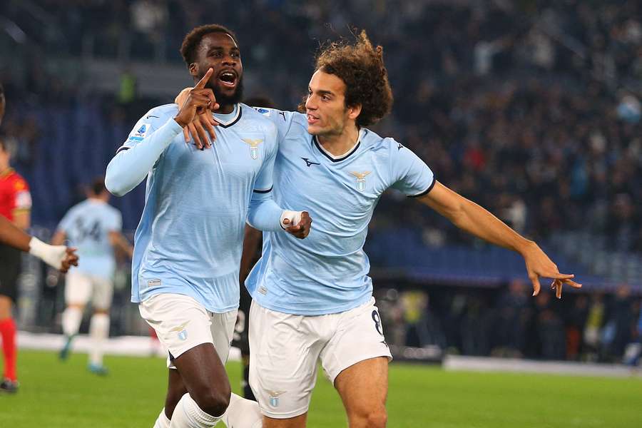 Lazio's Boulaye Dia and his teammate Matteo Guendouzi celebrate after scoring the opening goal 