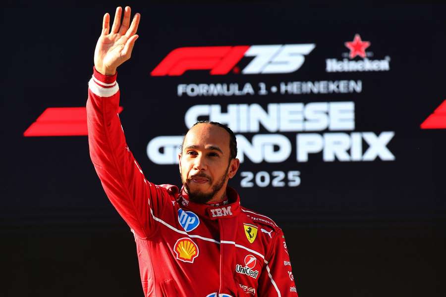 Hamilton waves to the crowd after his sprint pole