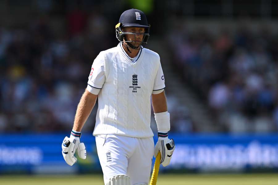 England's Joe Root reacts as he walks back to the pavilion after losing his wicket for 19