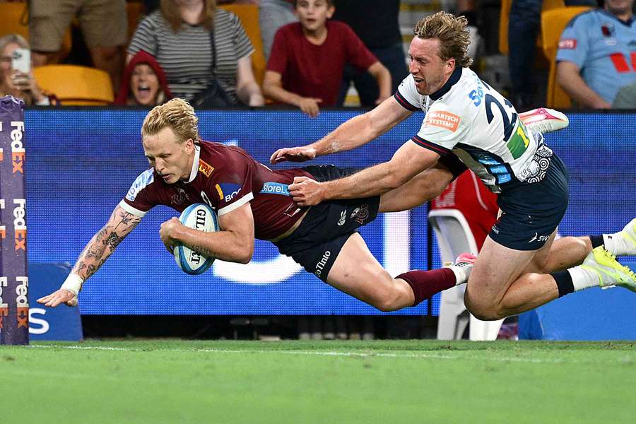 Carter Gordon scores a try for the Reds against the Waratahs.
