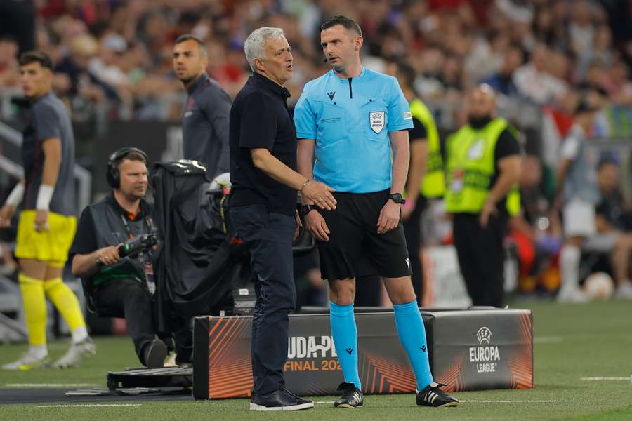 AS Roma coach Jose Mourinho remonstrates with fourth official Michael Oliver during the Europa League final