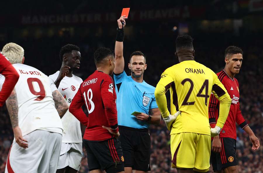 Referee Ivan Kruzliak shows a red card to Casemiro