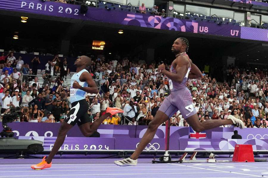 Letsile Tebogo crosses the line to win the Olympic semi-final ahead of Noah Lyles
