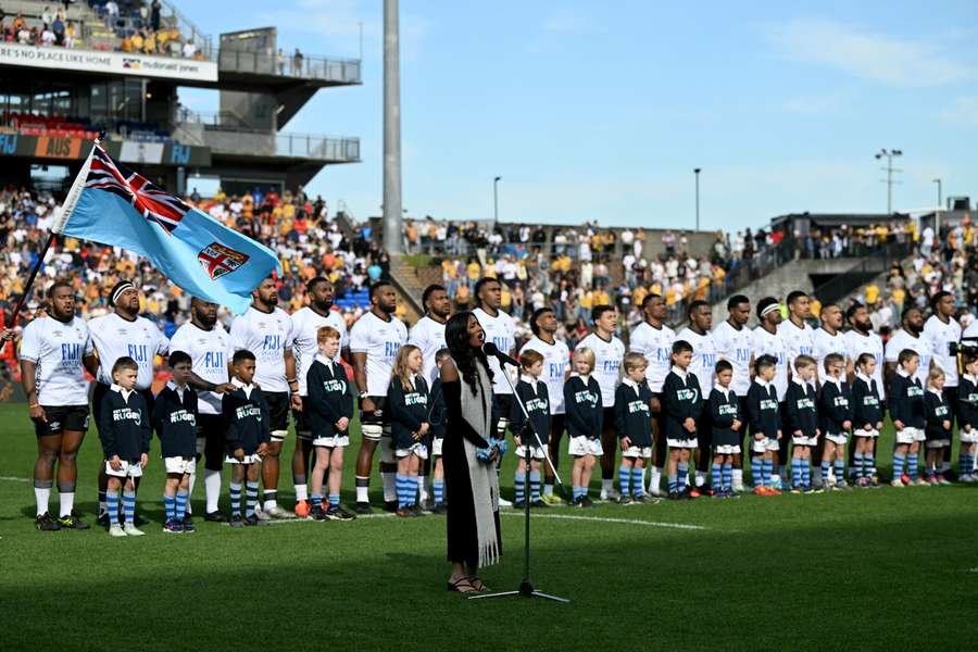 The Fijians line up to sing their national anthem during this month's match against Australia in Newcastle.
