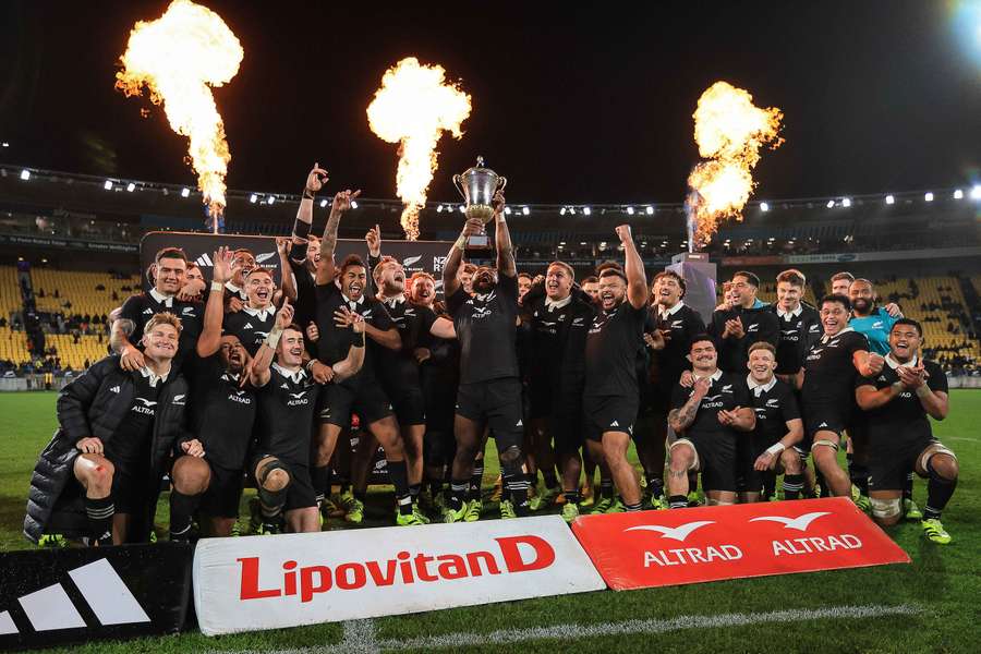The All Blacks celebrate their win
