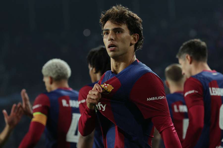 Barcelona's Portuguese forward #14 Joao Felix celebrates after scoring his team's second goal during the UEFA Champions League match with Porto