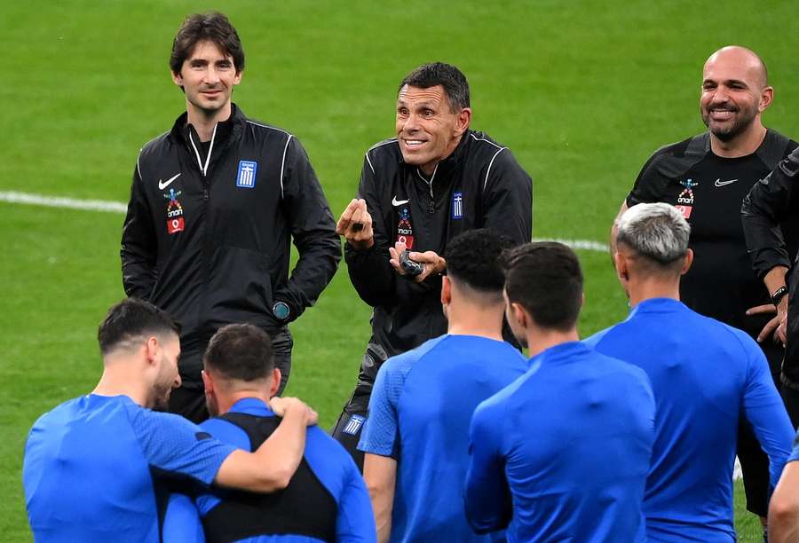 Poyet (centre) addresses his players during a training session while coach of Greece Poyet (centre) addresses his players during a training session while coach of Greece