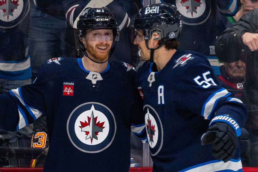 Winnipeg Jets players Kyle Connor (left) and Mark Scheifele (right) celebrating a goal