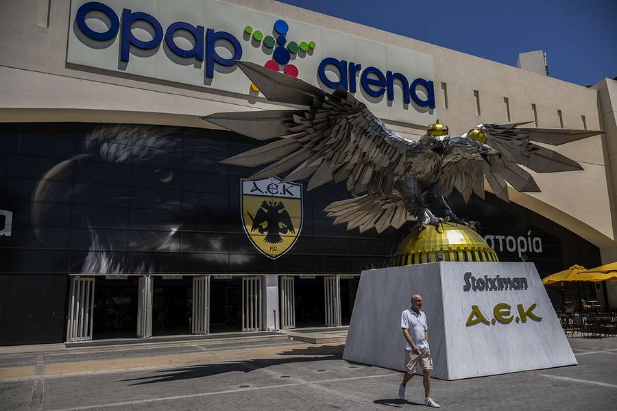 A man walks outside AEK Athens' OPAP Arena on August 8, 2023