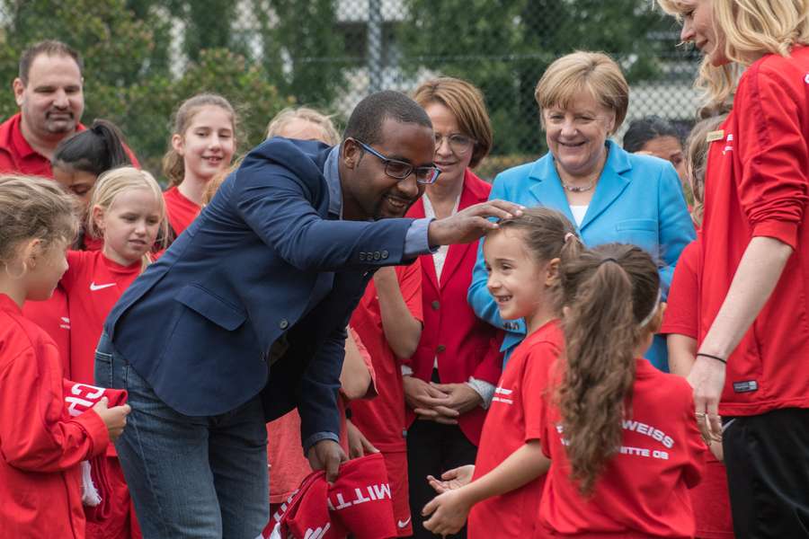 Cacau with then German Chancellor Angela Merkel at a social integration event in Berlin