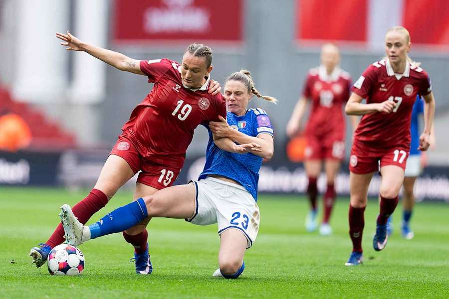 Denmark's forward Cecilie Floe and Italy's defender Cecilia Salvai vie for the ball during 