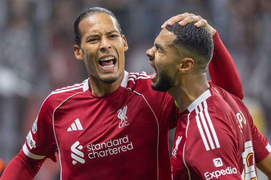 Virgil van Dijk (L) celebrates a goal with Cody Gakpo Virgil van Dijk (L) celebrates a goal with Cody Gakpo