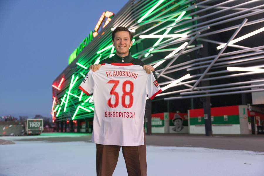 Michael Gregoritsch in front of his new home stadium in Augsburg