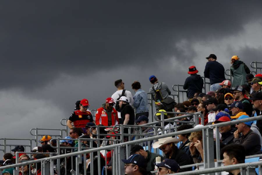 Fans in the stands look out for dark clouds at the Australian Grand Prix