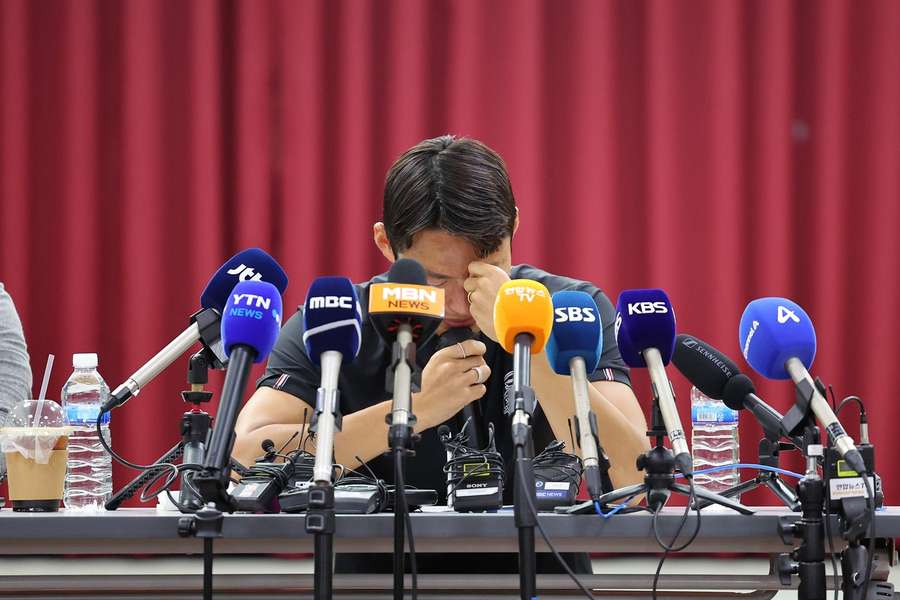 South Korea's Son Jun-Ho gets emotional during a press conference