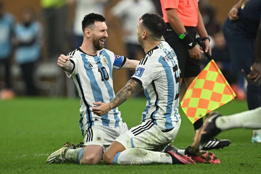Lionel Messi and Leandro Paredes embrace after the shootout win