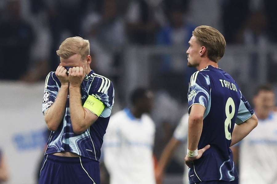 Ajax captain Davy Klaassen (L) and Kenneth Taylor sulk after the 4-0 loss at Marseille
