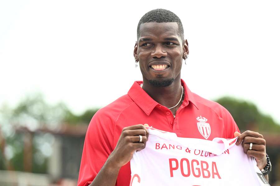 French midfielder Paul Pogba poses with his new jersey following his official presentation in Monaco,