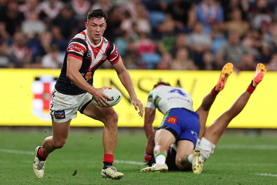 Joey Manu with ball in hand for the Roosters in 2024.