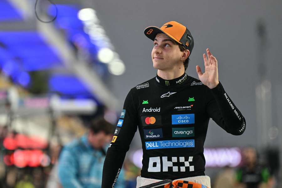 Oscar Piastri waves to the fans as he walks to his car ahead of the Qatar sprint race