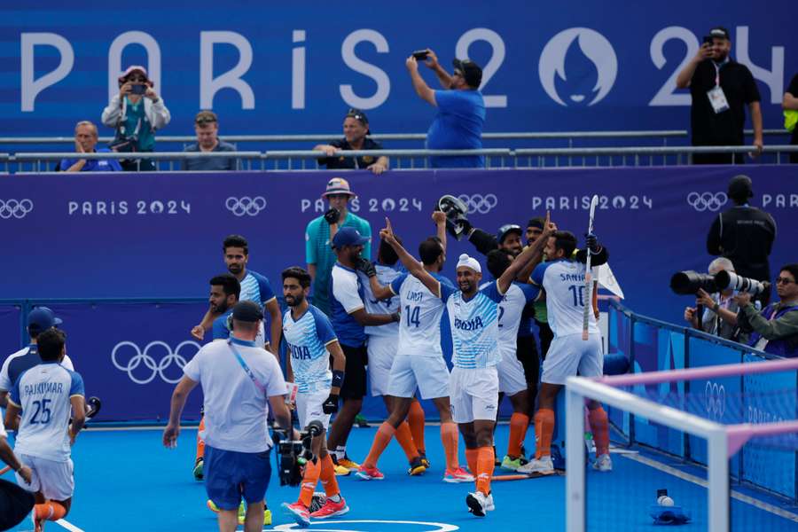 Sanjay Sanjay of India celebrates with teammates 