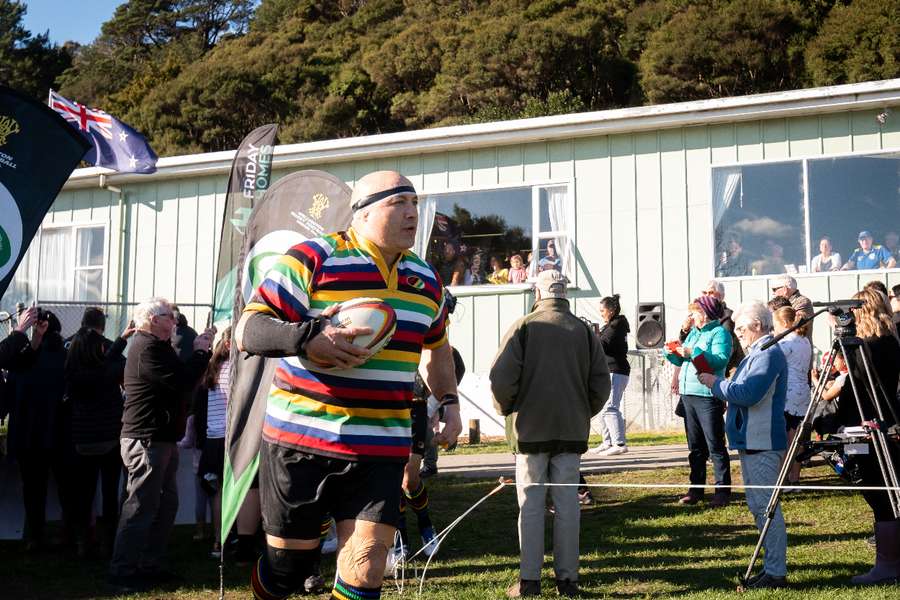 Norm Hewitt leads his team on to the field before the 25th annual parliamentary rugby match on July 25, 2020 in Wellington, New Zealand