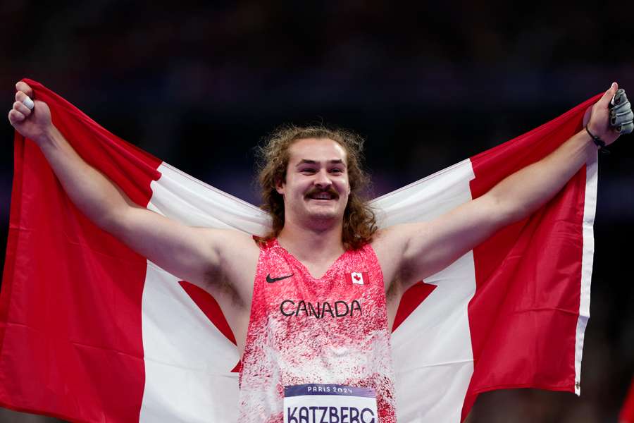 Ethan Katzberg celebrates gold medal