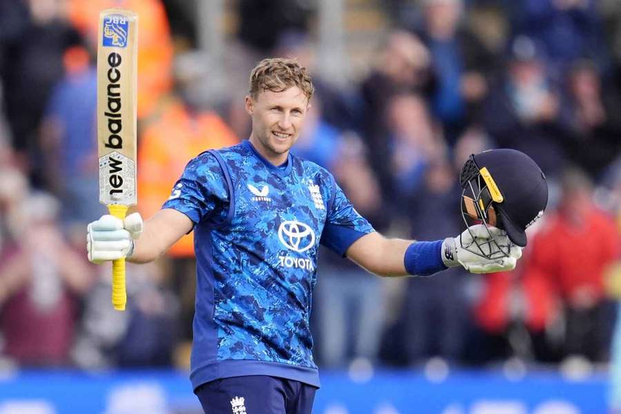 Root celebrates his century