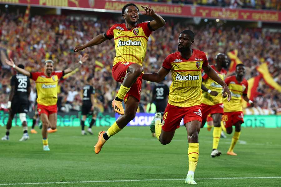 Lois Openda, left, celebrates one of his 21 goals for Lens last season