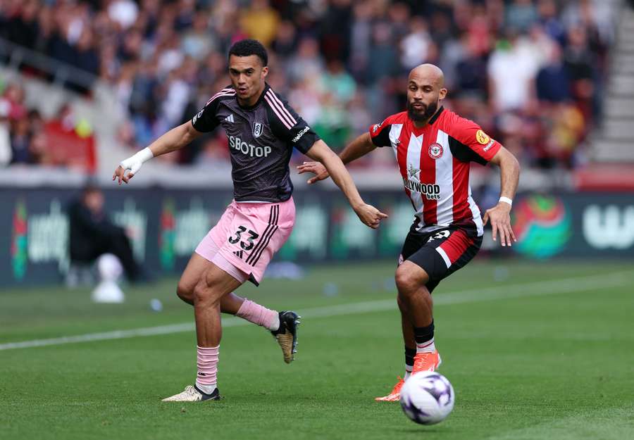 Antonee Robinson of Fulham battles for possession with Jack Robinson of Brentford