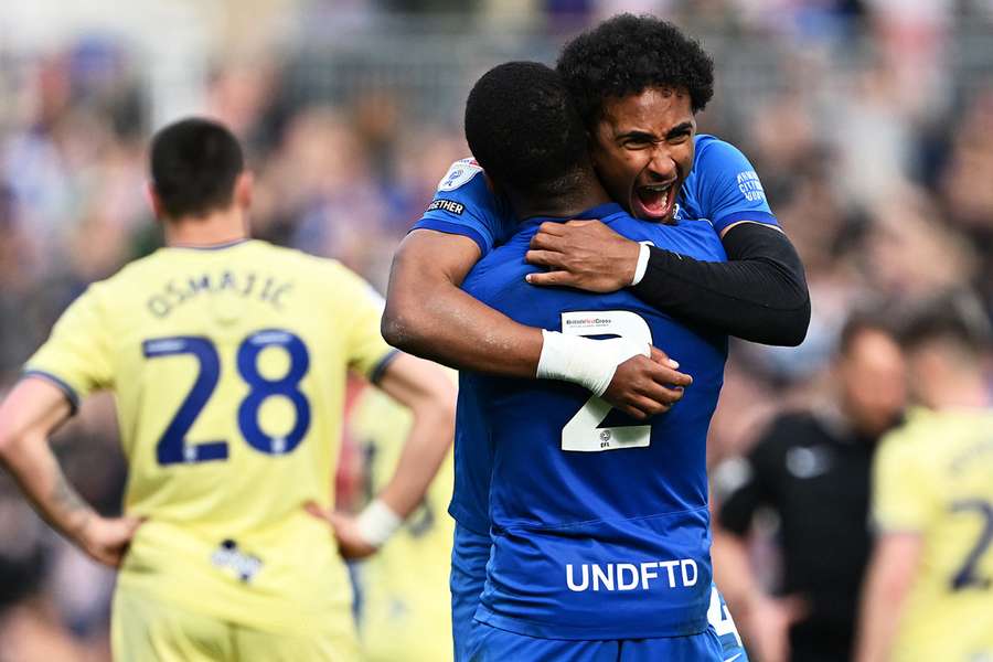 Ethan Laird and Emanuel Aiwu of Birmingham City embrace after the team's victory