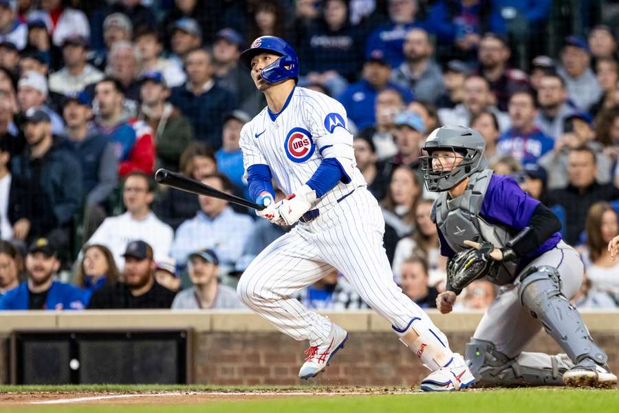 Chicago Cubs' Seiya Suzuki running out of the batter's box after hitting a two-run single against the Colorado Rockies (2025)