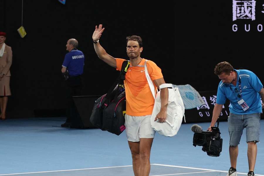 Rafael Nadal waves to the fans after losing his second round match