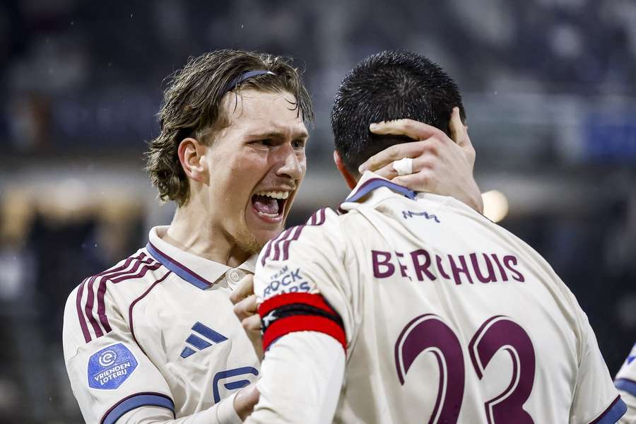 Ajax's Mika Godts (L) celebrates Steven Berghuis' 2-0 against Heracles Almelo