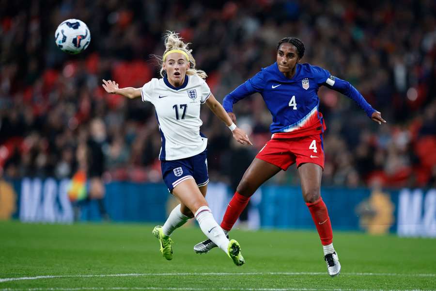 England's Chloe Kelly attempts to block Naomi Girma's cross