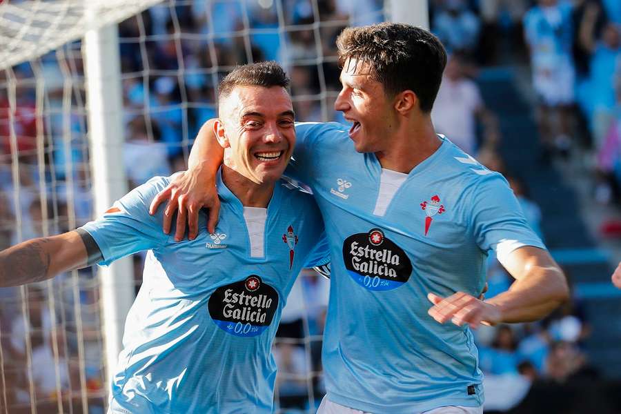 Celta Vigo's Iago Aspas, left, celebrates his goal