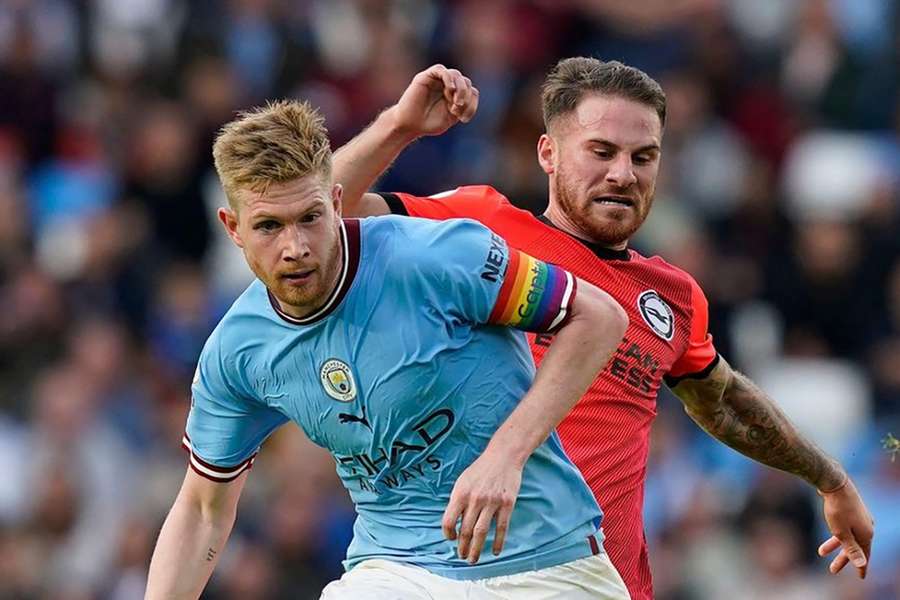 City's De Bruyne and Brighton's Mac Allister fight for the ball