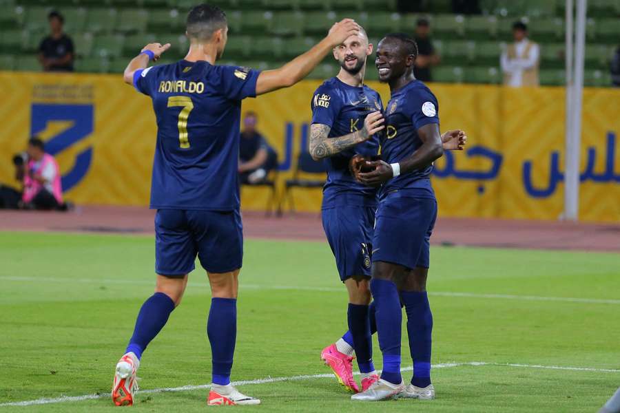 Al-Nassr's Cristiano Ronaldo (L), Marcelo Brozovic (C) and Sadio Mane celebrate Al-Nassr's Cristiano Ronaldo (L), Marcelo Brozovic (C) and Sadio Mane celebrate