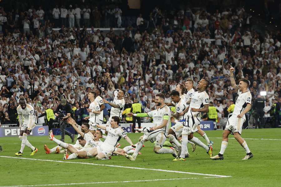 Real Madrid's players celebrate victory at the end of the UEFA Champions League semi-final 