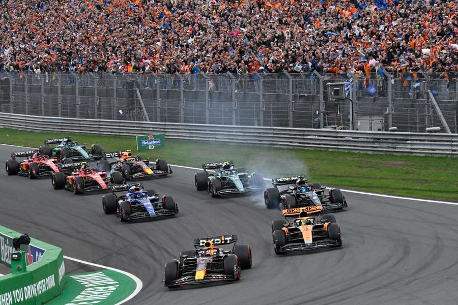 Drivers, including Red Bull's Max Verstappen (Bottom C), compete during the Dutch Grand Prix