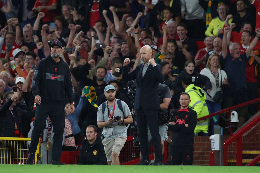 Erik ten Hag, right, celebrates his side's win as Jurgen Klopp watches on