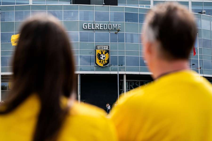Vitesse fans look at the logo on the club's GelreDome stadium