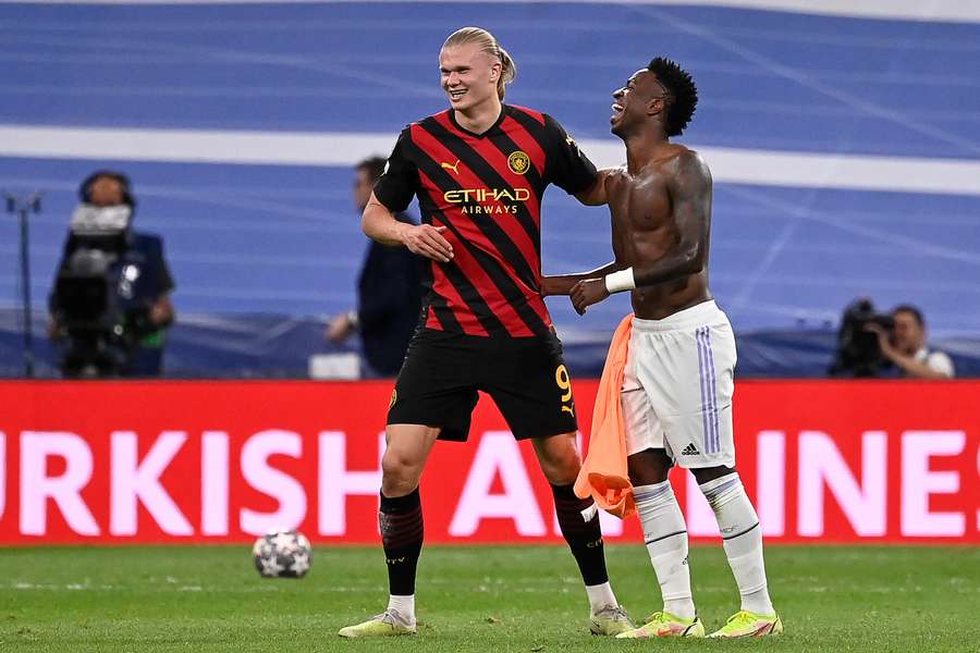 Manchester City striker Erling Haaland and Real Madrid forward Vinicius Junior (R)